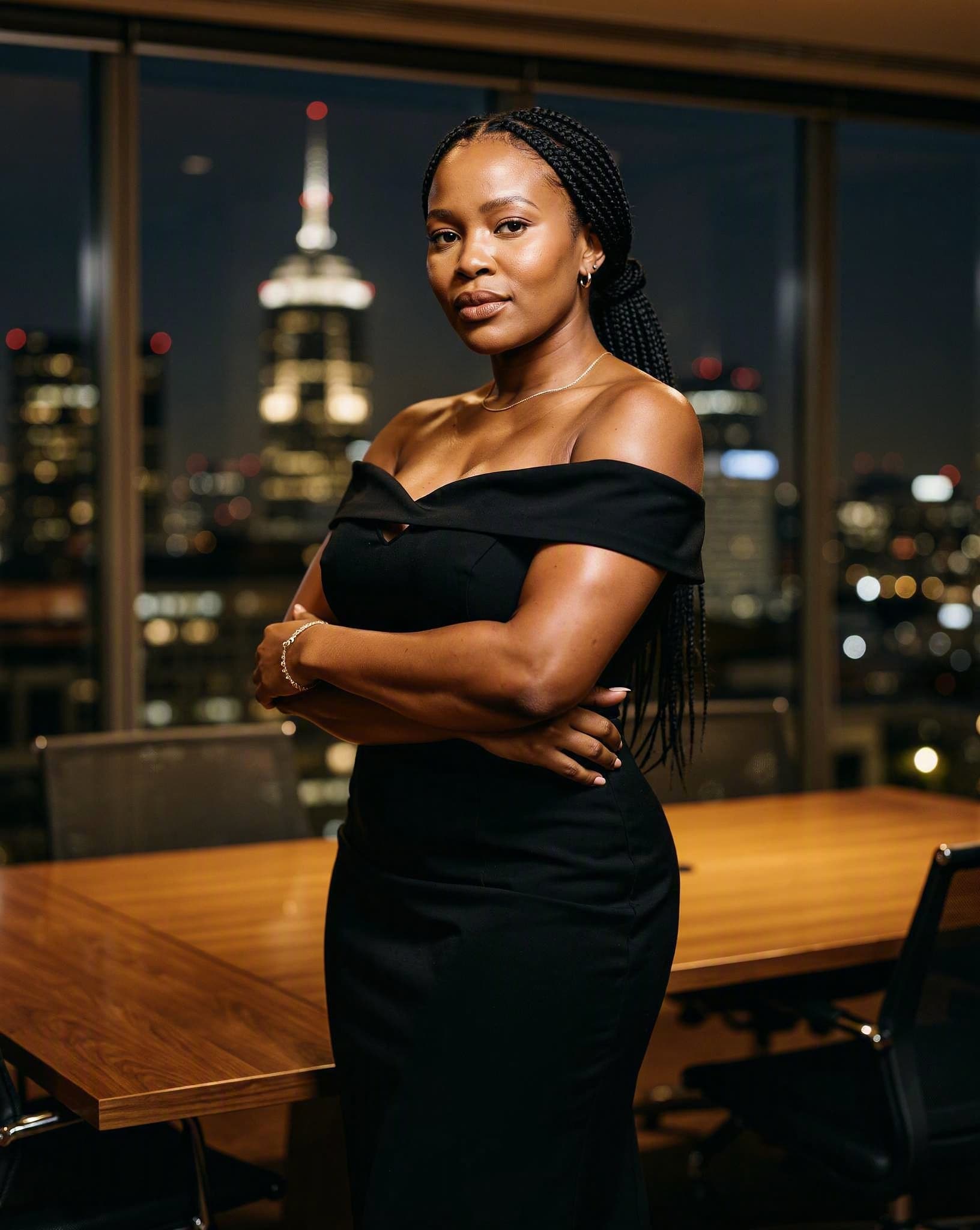 Thandeka in a black gown in a Sandton boardroom — a No Safe Word character